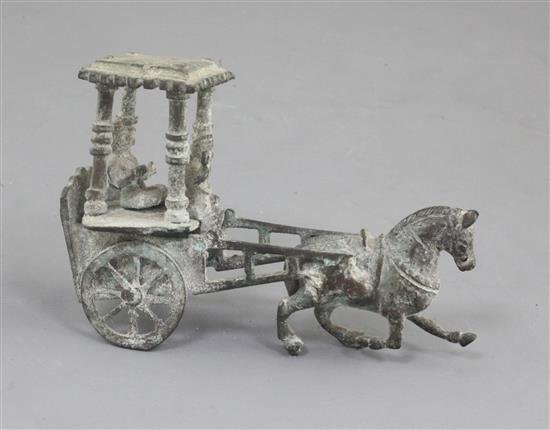 A Chinese archaic bronze model of a horse and carriage, Han dynasty, 2nd century B.C.-2nd century A.D., 12.5cm long, losses